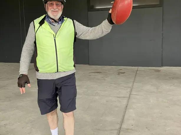 AU Melbourne by Bike Guide Geoff loves Aussie Rules Travel Essence