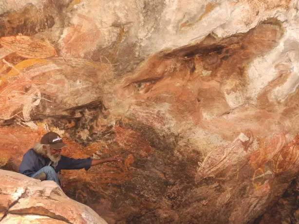 Aboriginal tour guide with rock art