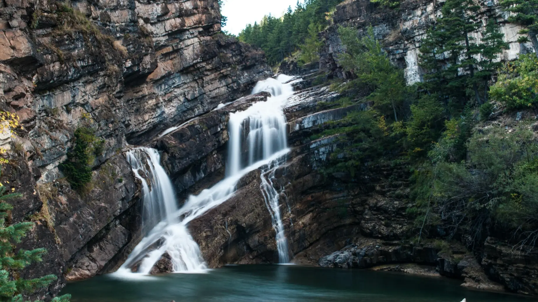 CA Alberta Waterton Lakes NP waterfall luis perdigao unsplash