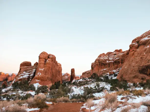 People walking through Arches National Park in Utah during winter