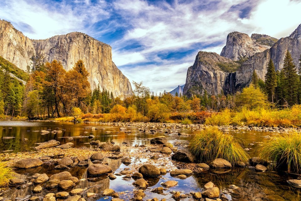 Yosemite National Park in California during autumn with yellow and brown leaves on the trees