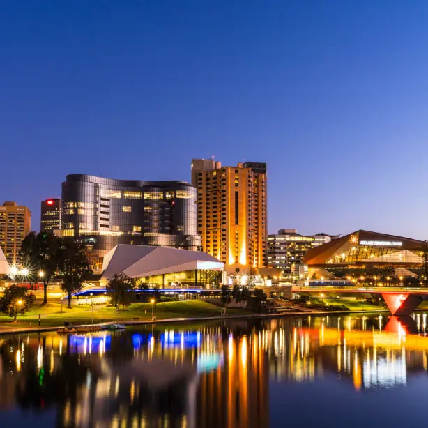 South Australia – Adelaide’s skyline at night, with lights reflecting on the water