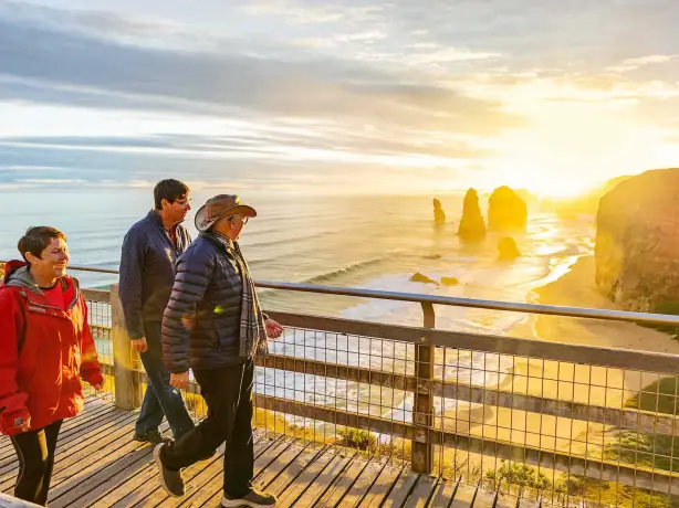 People walking looking towards the view of the twelve apostles