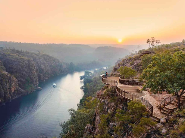 Two people looking over Katherine River from a point lookout in Australia