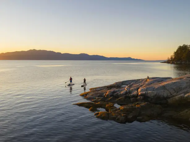 Two people stand-up paddle boarding, Sunshine Coast