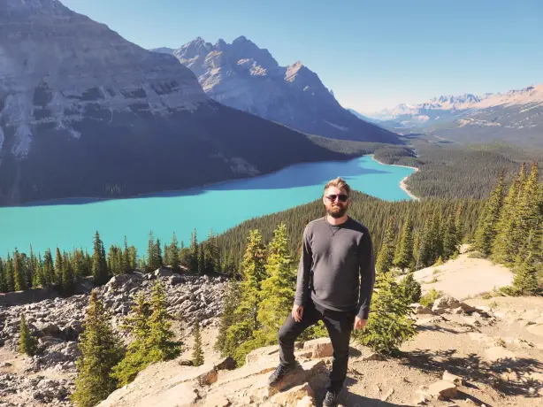 Luke Northeast with glacial lake, mountains and forest behind