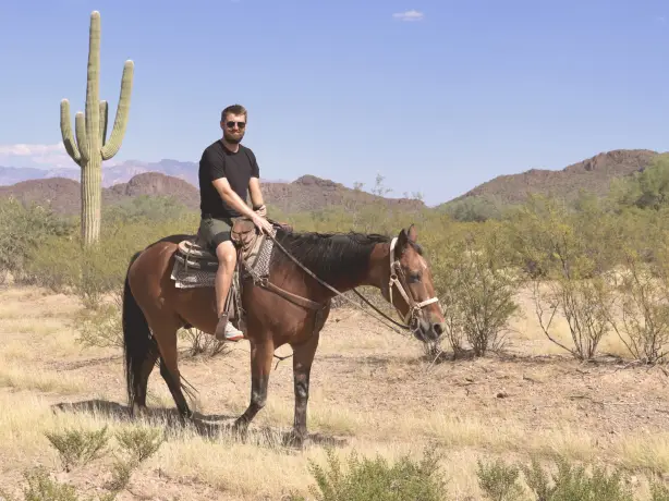 Luke, travelessence expert, on a horse