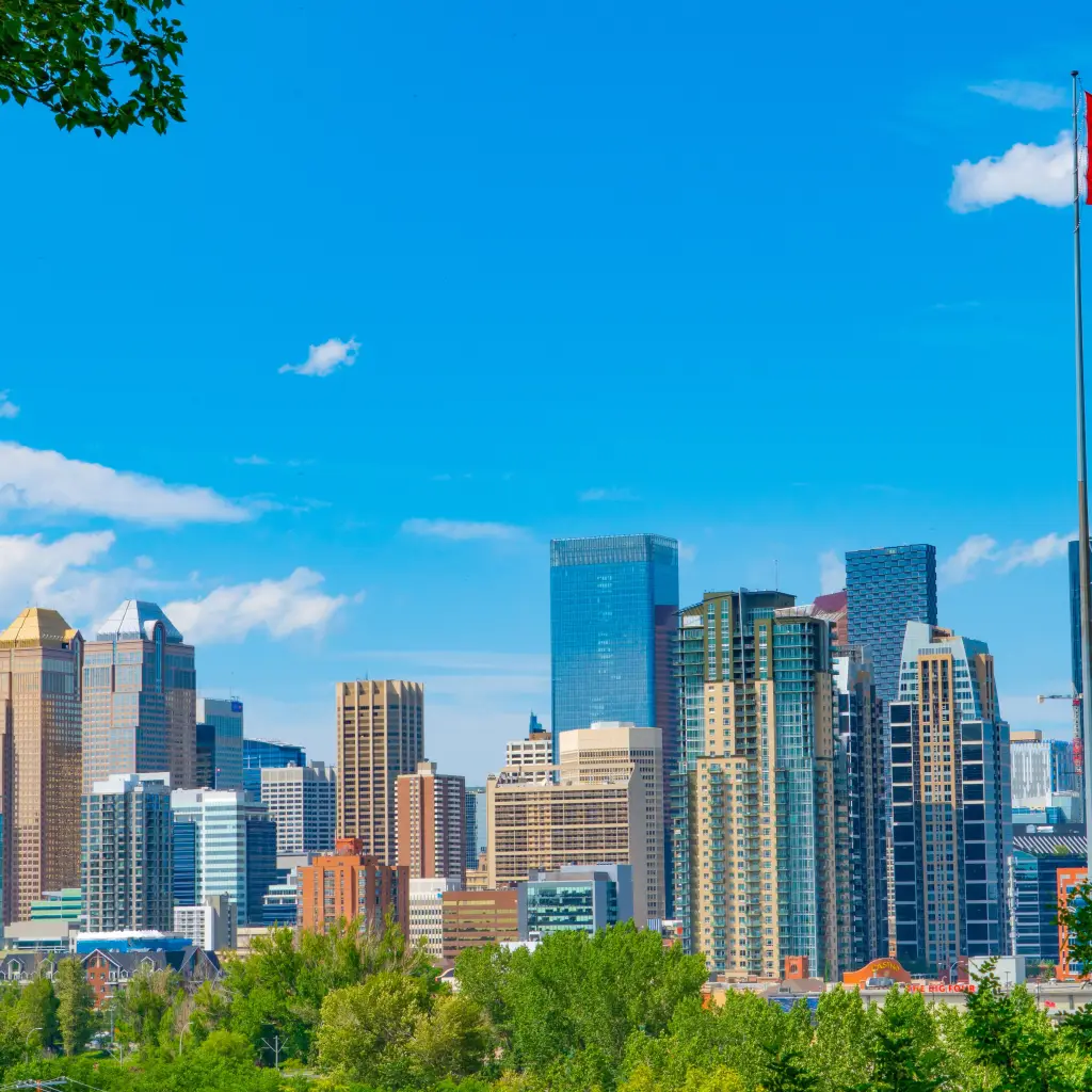 A view of the Calgary city skyline with a Canadian flag