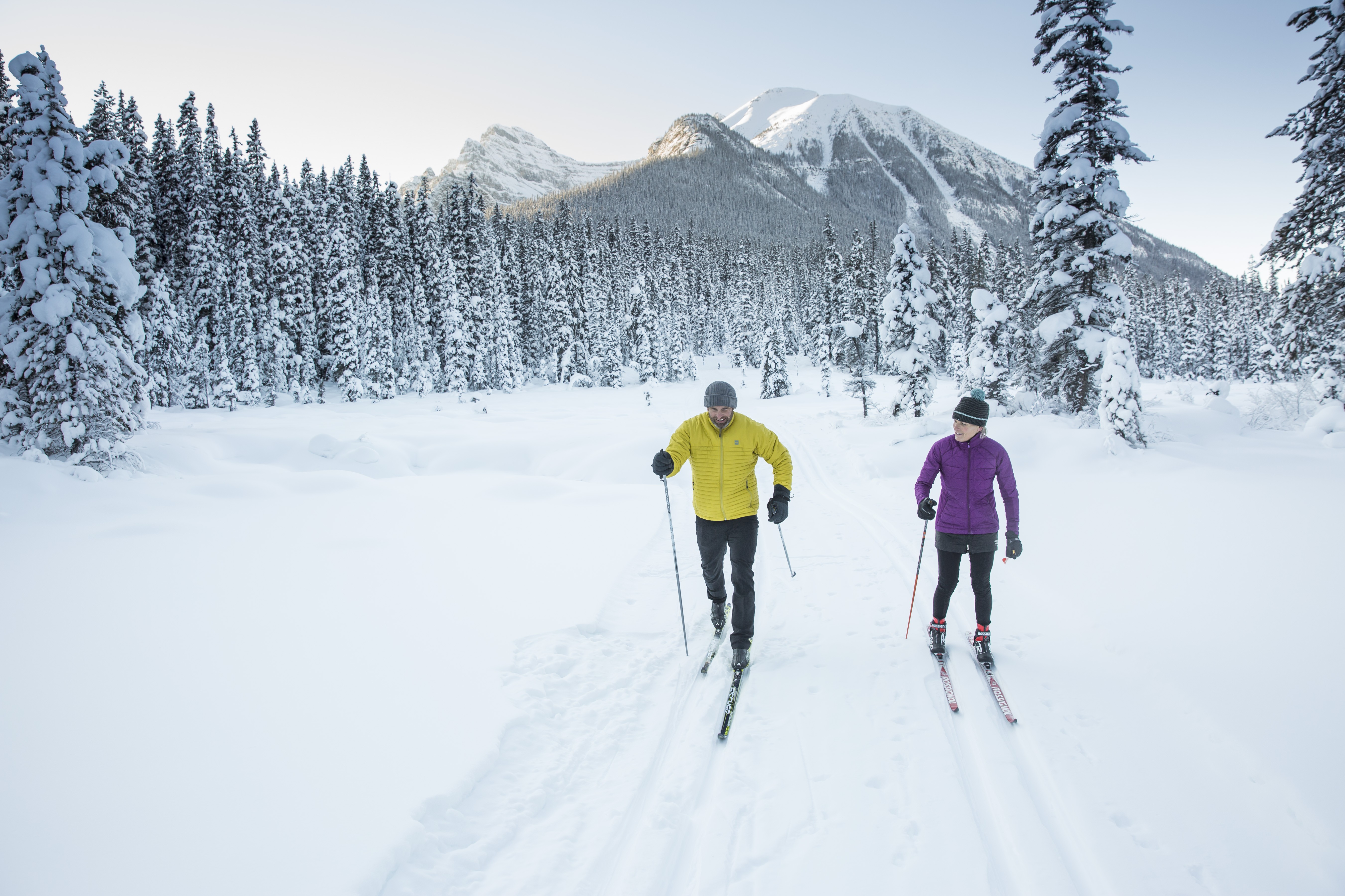 ca_couples_winter cross country skiing great divide trail lake louise