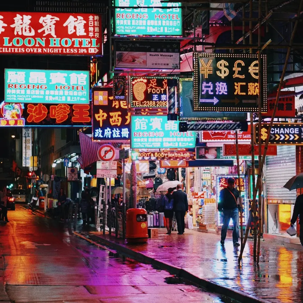 Street with neon lights at night in Hong Kong