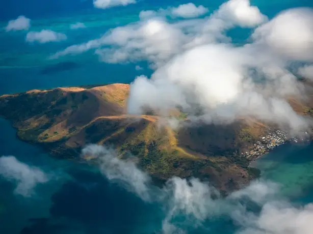 Aerial view of an island through the clouds