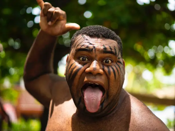 A local man with traditional face paint