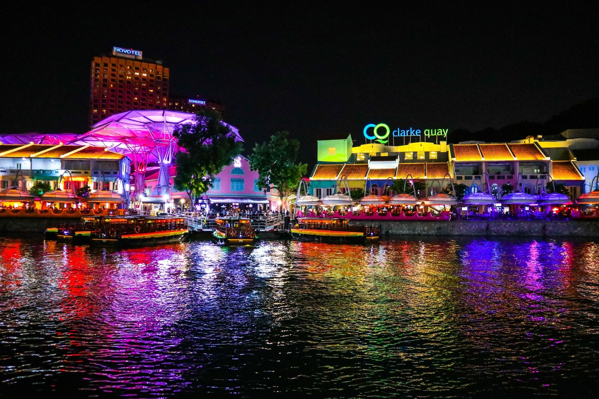 River at night with brightly lit promenade