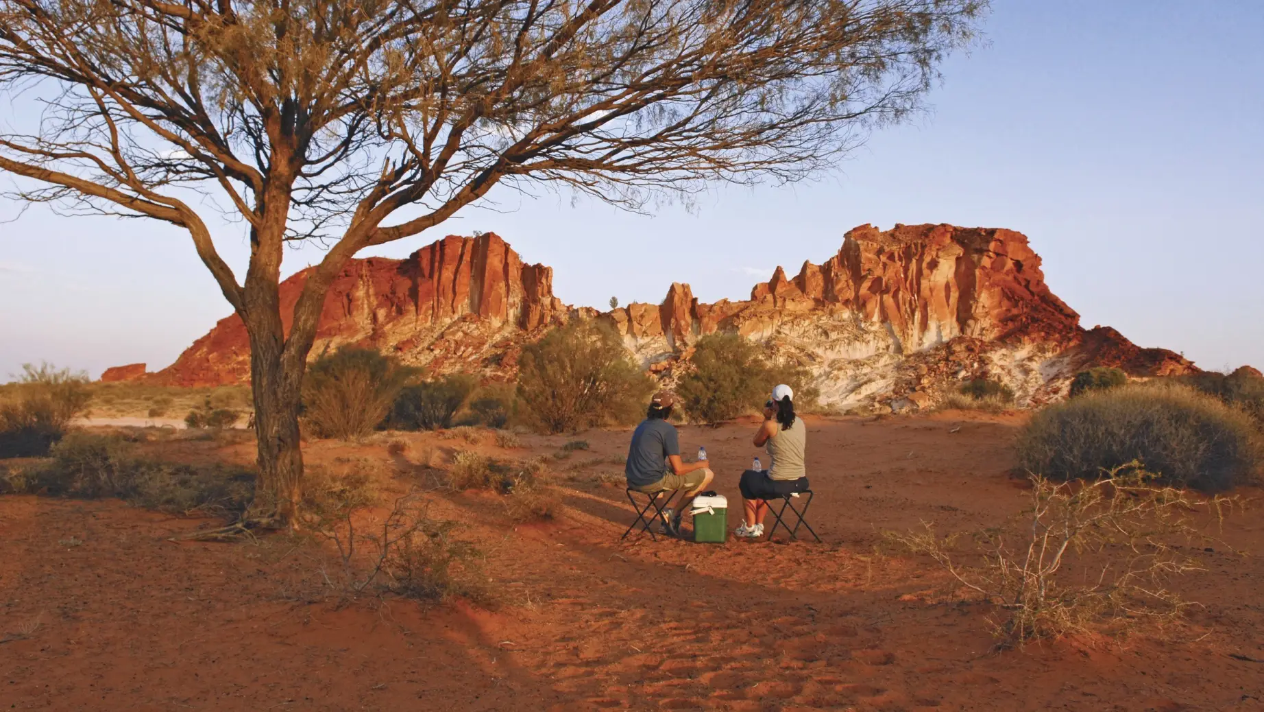 A couple having a picknick in the Australian outback