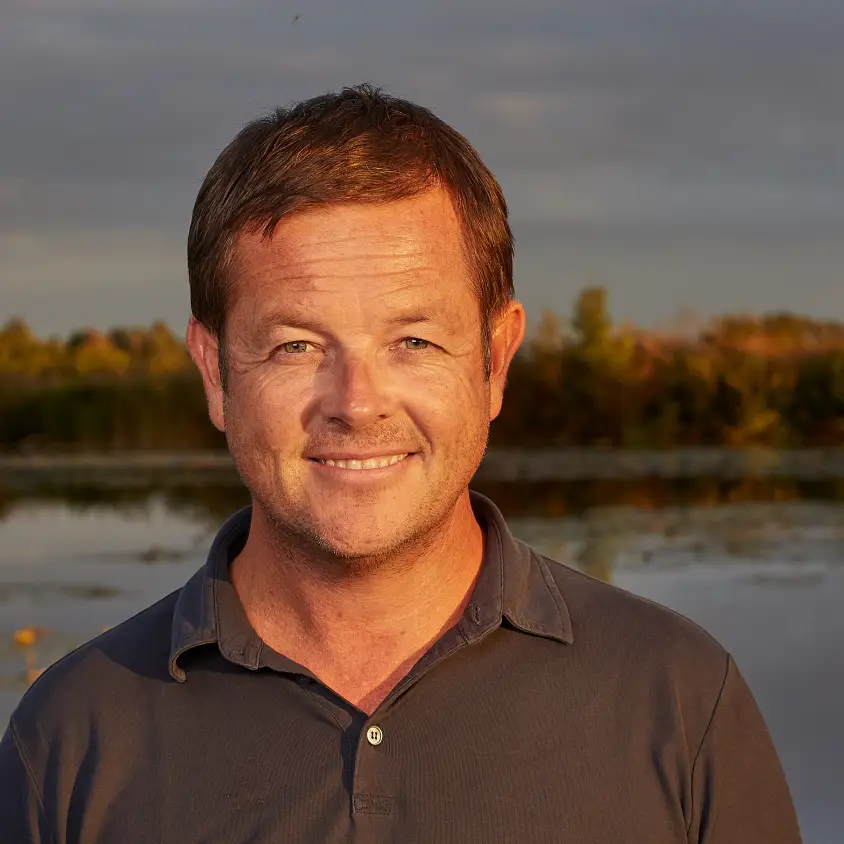 Andrew Morton smiling at the camera