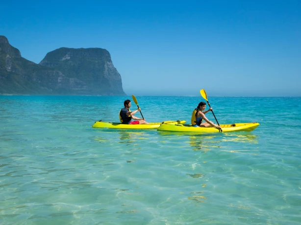 Two people sea kayaking on Lord Howe Island, Australia