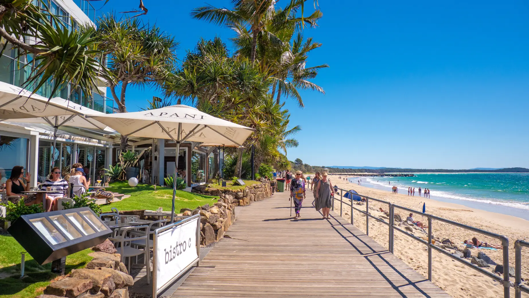 Walking stretch along the noosa beach
