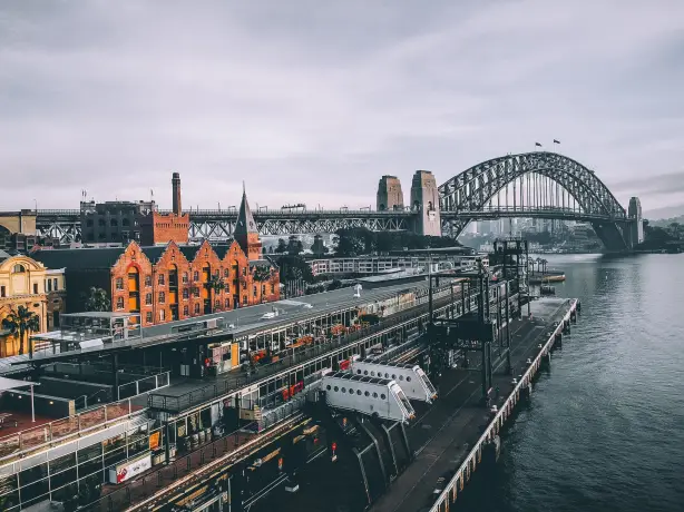 Aus nsw sydney train station harbour bridge unsplash