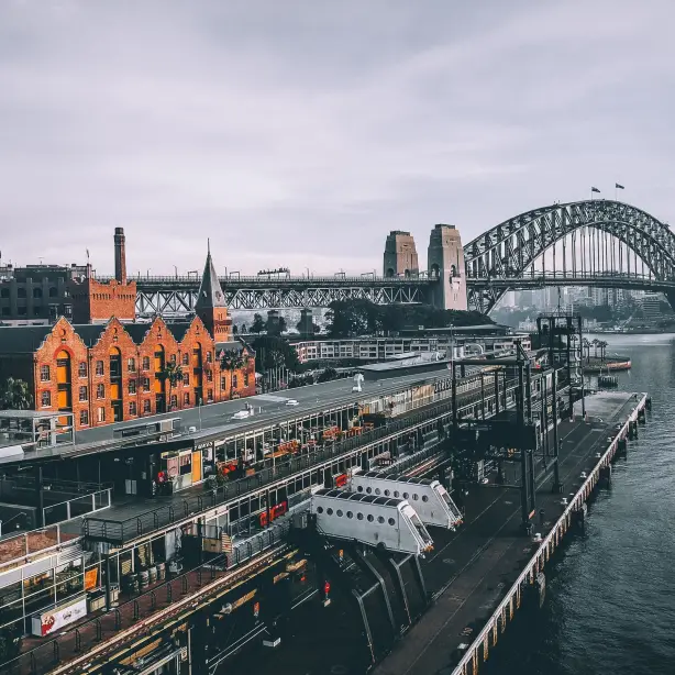 Aus nsw sydney train station harbour bridge unsplash