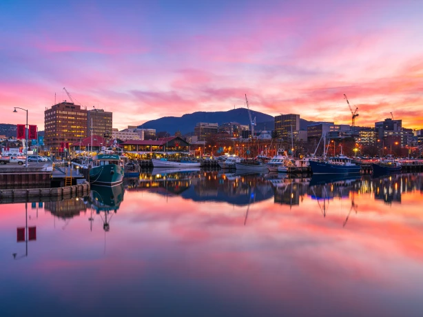 Colourful evening clouds reflecting on the water at the small harbour of Tasmania, Hobart
