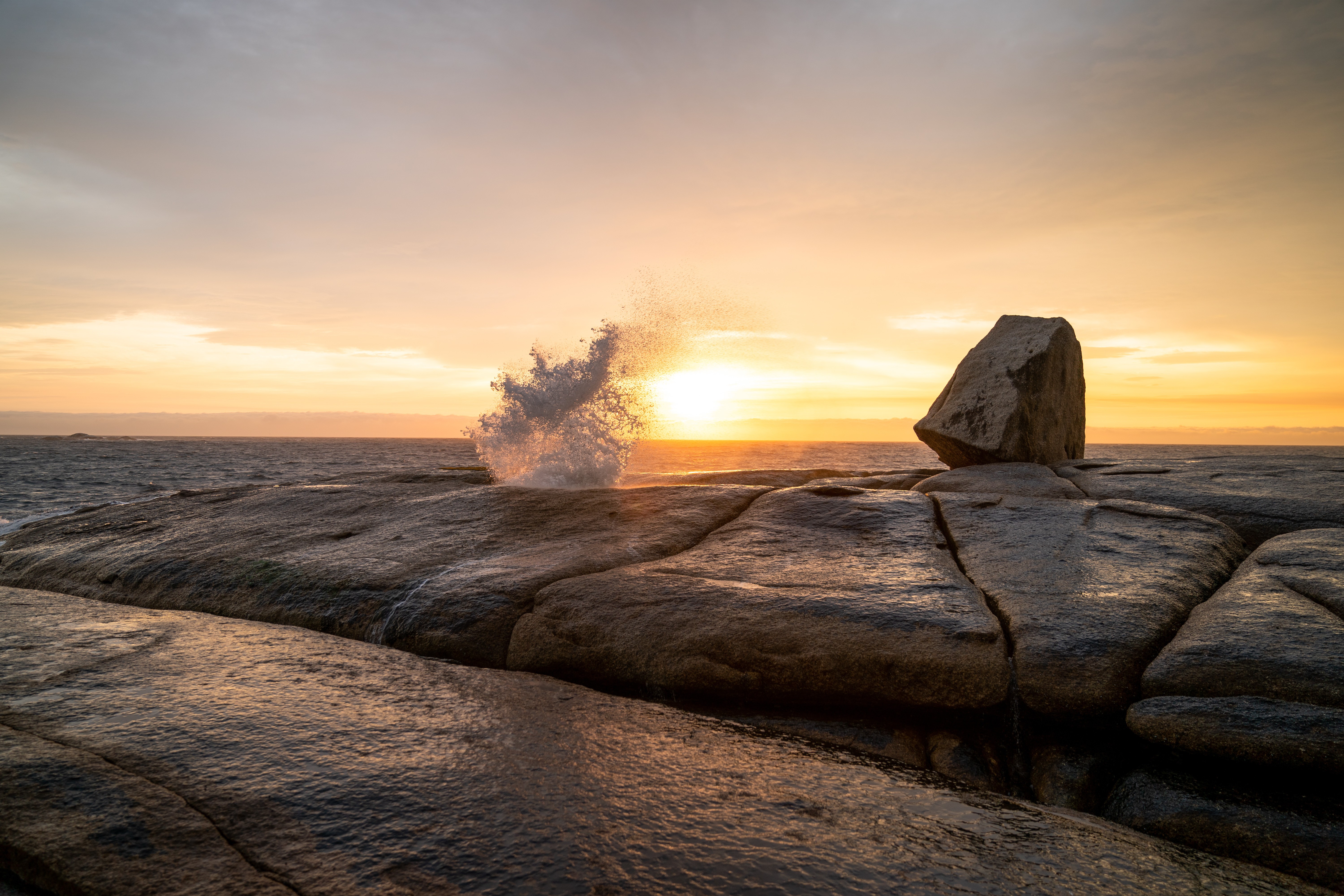 Sunset at the Bicheno Blowhole by the sea in Tasmania, Australia