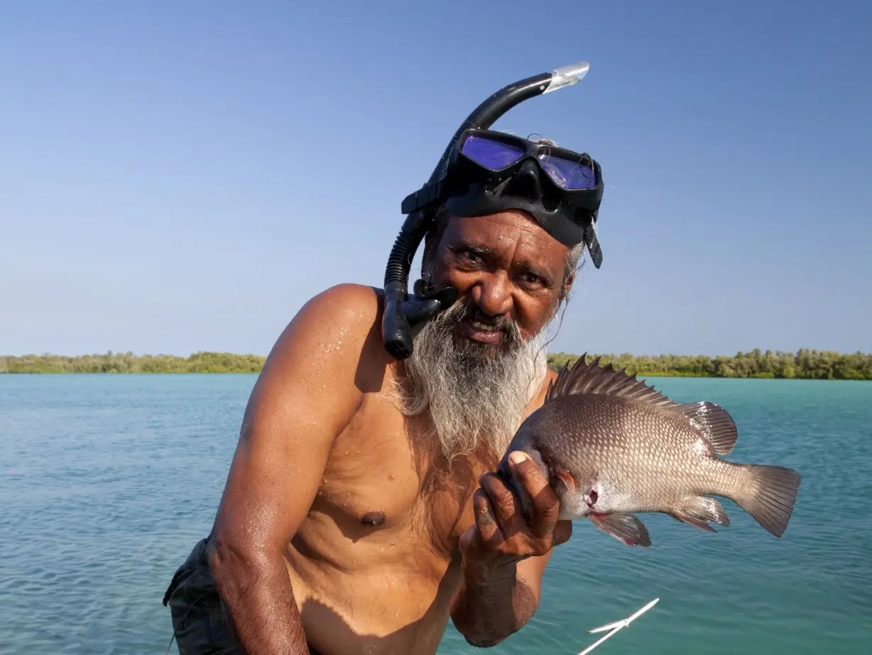 Indigenous guide in Australia, showing traditional fishing methods