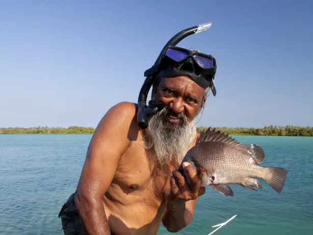 Indigenous guide in Australia, showing traditional fishing methods