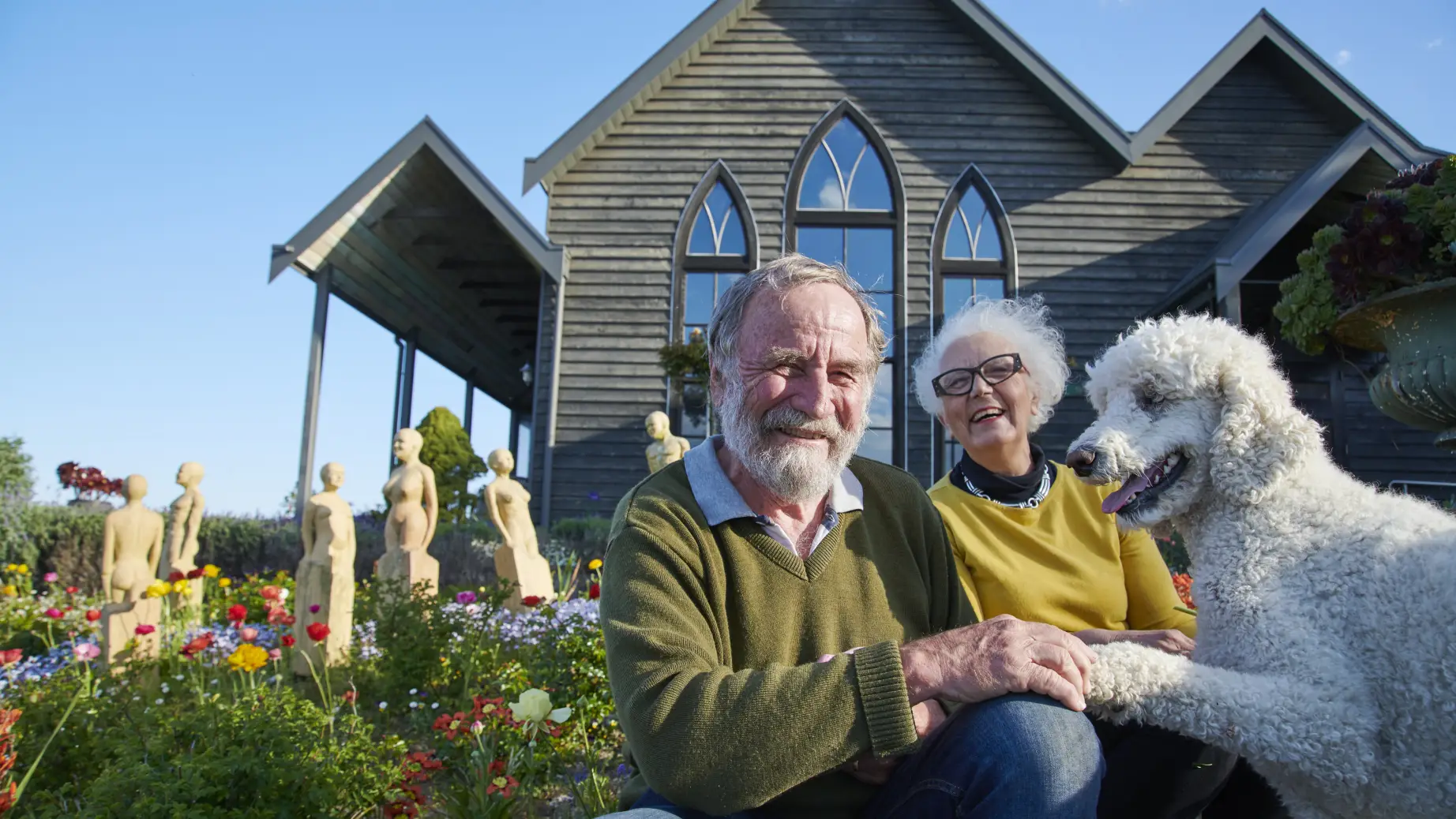Church house hosts smiling at the camera in Australia