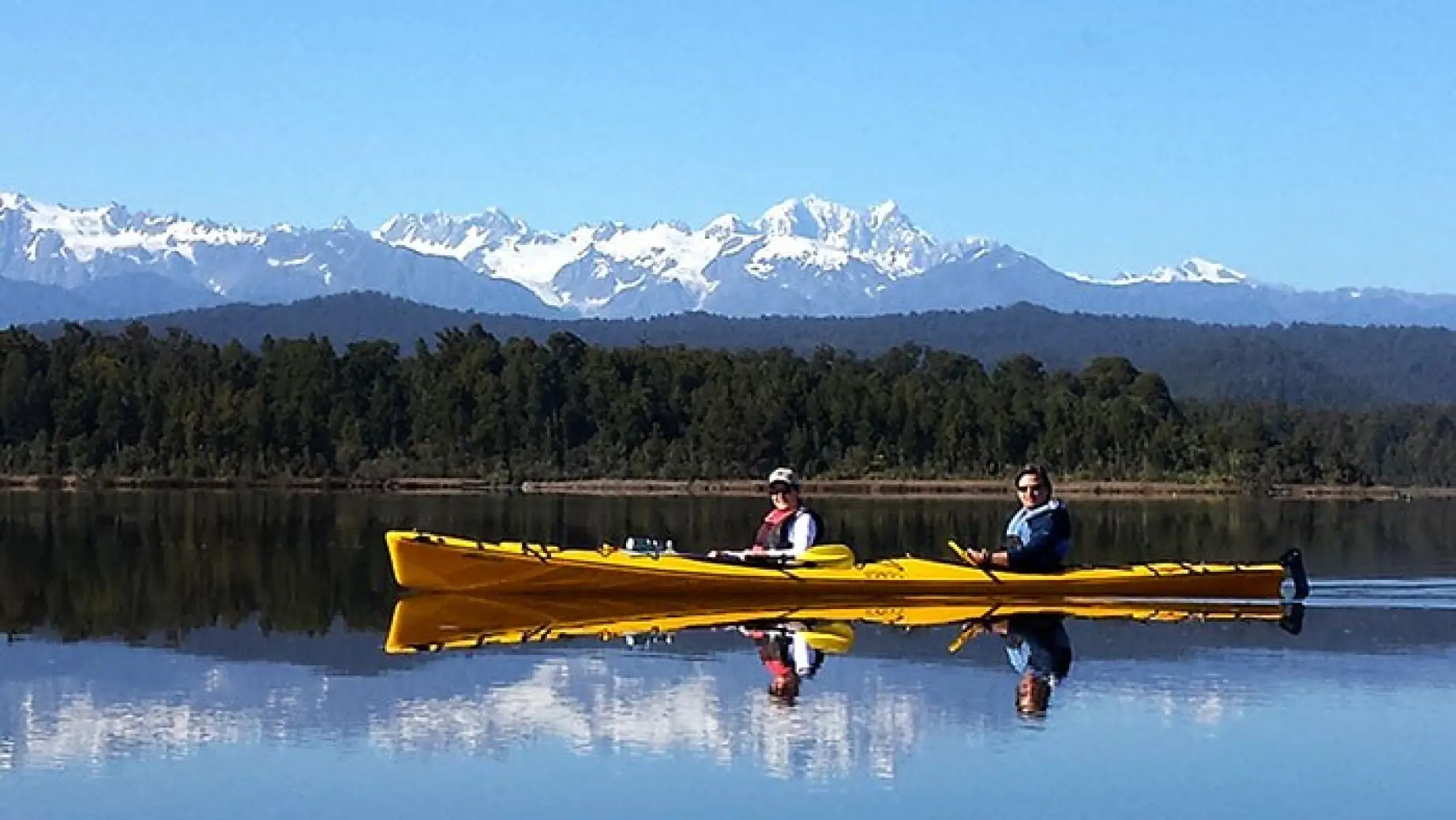 Neuseeland Okarito Kajak fahren Berge See