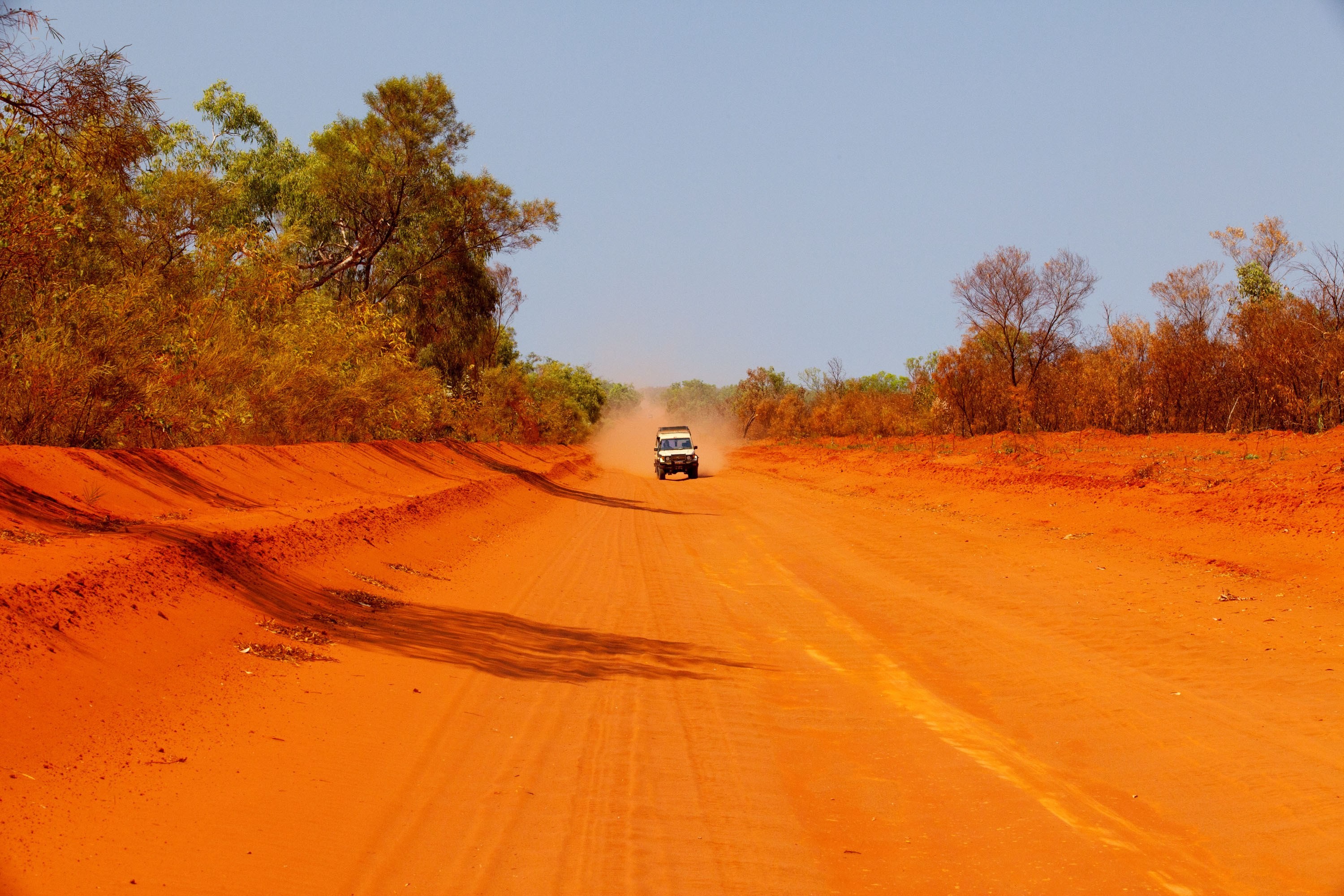 Australia, Alice Springs – a car driving along a dirt road