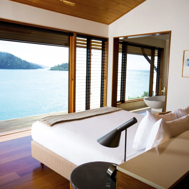 Hamilton island accommodation view looking over over the bed to the ocean view in the background