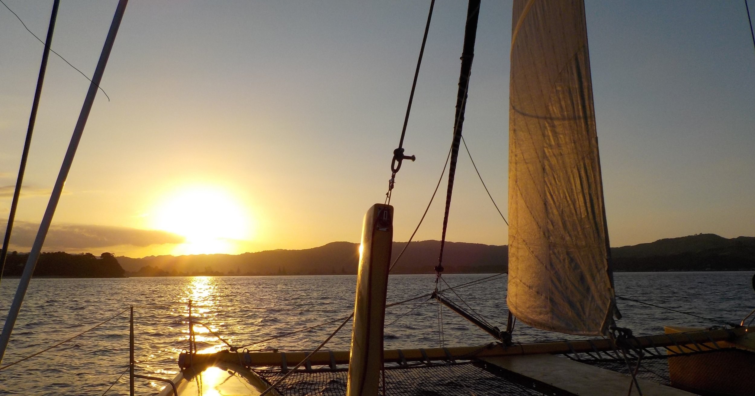 Nz coromandel sail sunset boom sailing