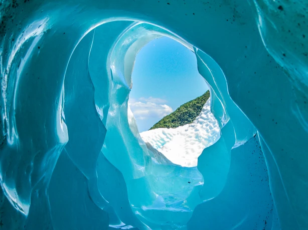 A look through an ice tunnel on the Franz Josef Glacier in New Zealand
