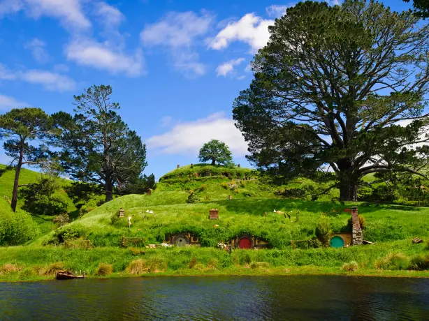Hobbit holes on a hillside in Hobbiton in Waikato, New Zealand