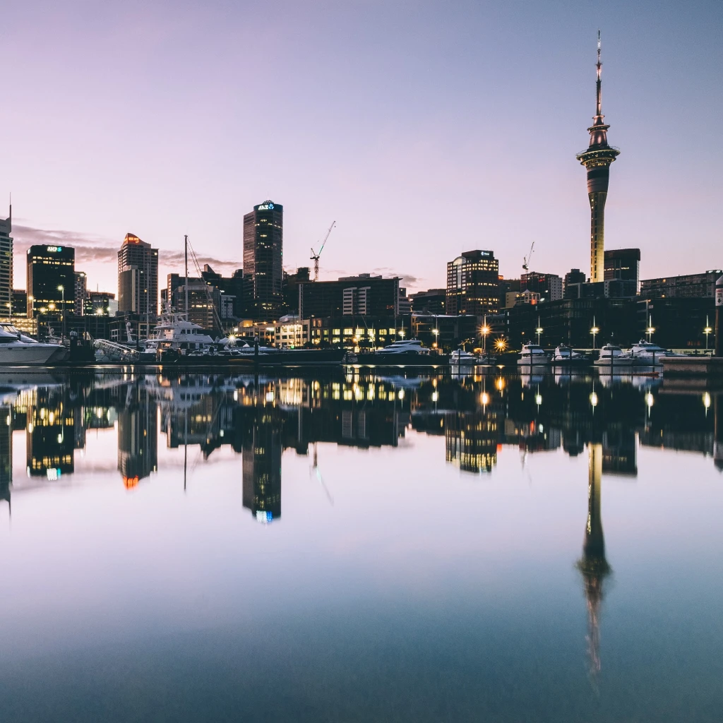 A skyline view of the harbour city, buildings reflecting in the water in New Zealand, Auckland