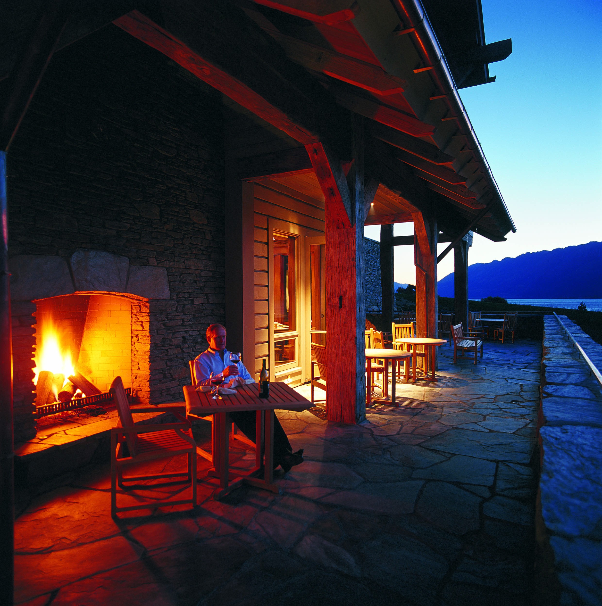 nz-south-glenorchy-lodge-terrace-wine-fireplace-luxury.jpg