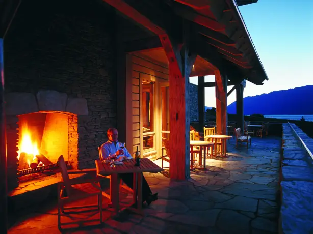 nz-south-glenorchy-lodge-terrace-wine-fireplace-luxury.jpg