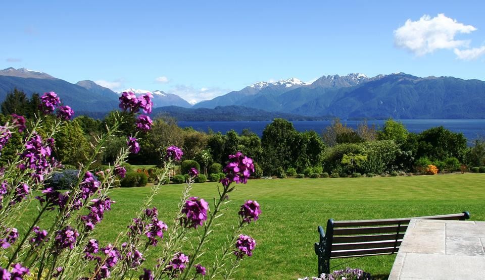 Nz te anau lodge garden view flowers mountain stays comfortable