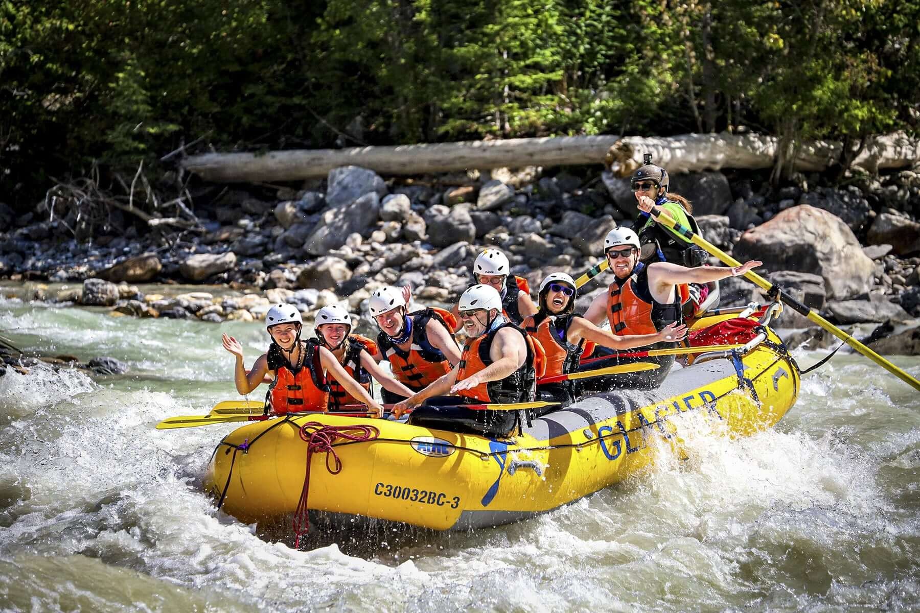 A group enjoy a white water rafting adventure on the Kicking Horse River in British Columbia