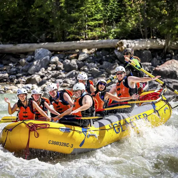 A group enjoy a white water rafting adventure on the Kicking Horse River in British Columbia