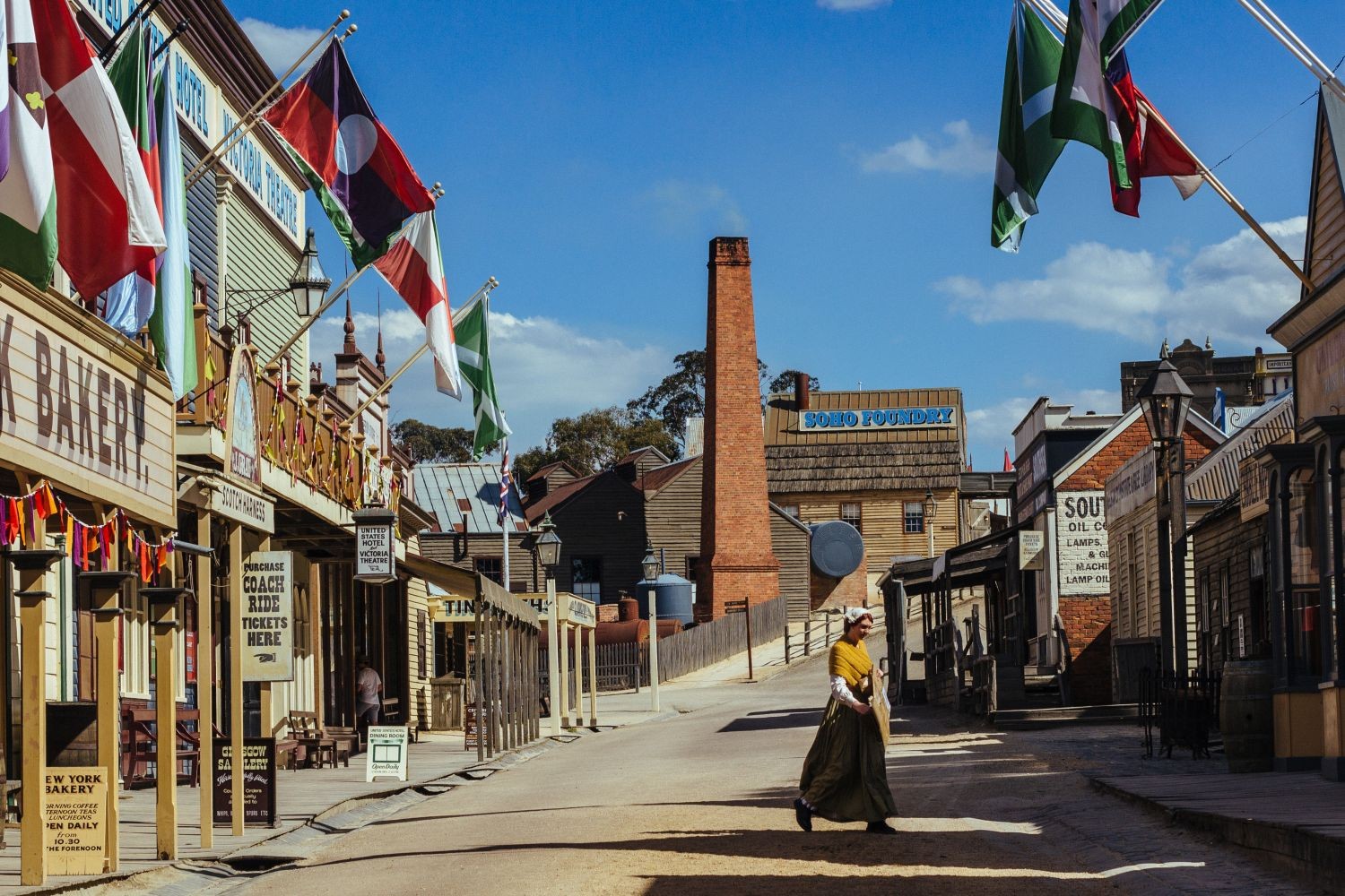 A woman walking through a victorian goldfields town