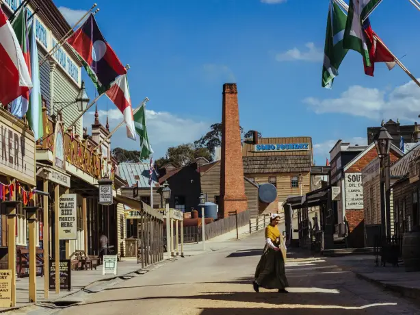 A woman walking through a victorian goldfields town
