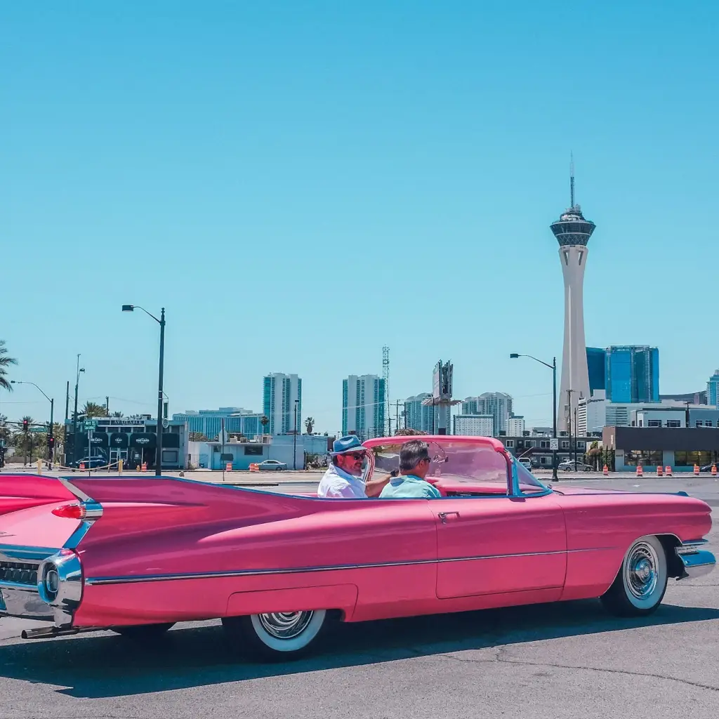 An image of two men driving in the city of Las Vegas