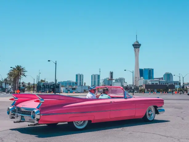 An image of two men driving in the city of Las Vegas