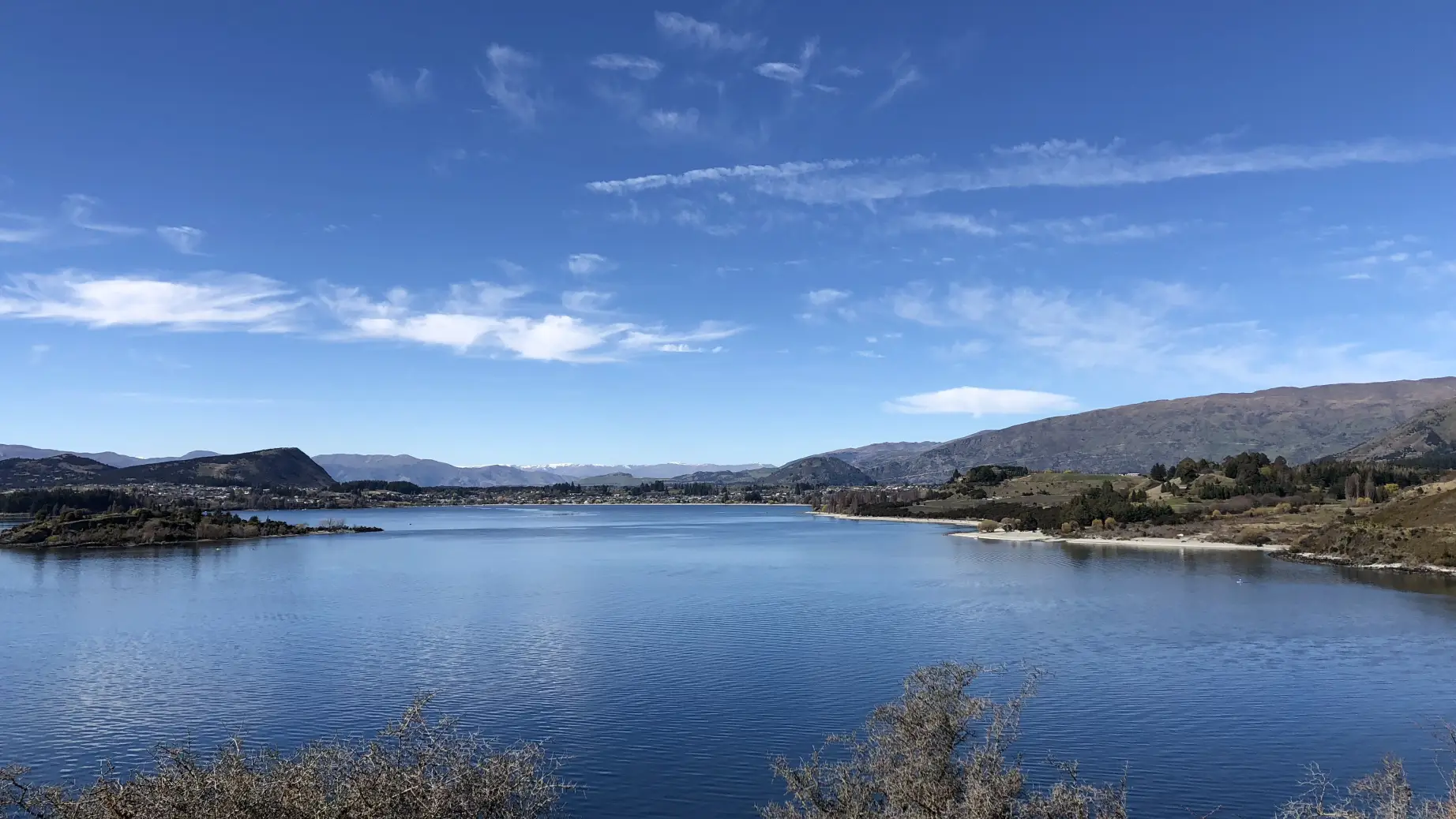 overlooking lake wanaka with mountains and hills in the background